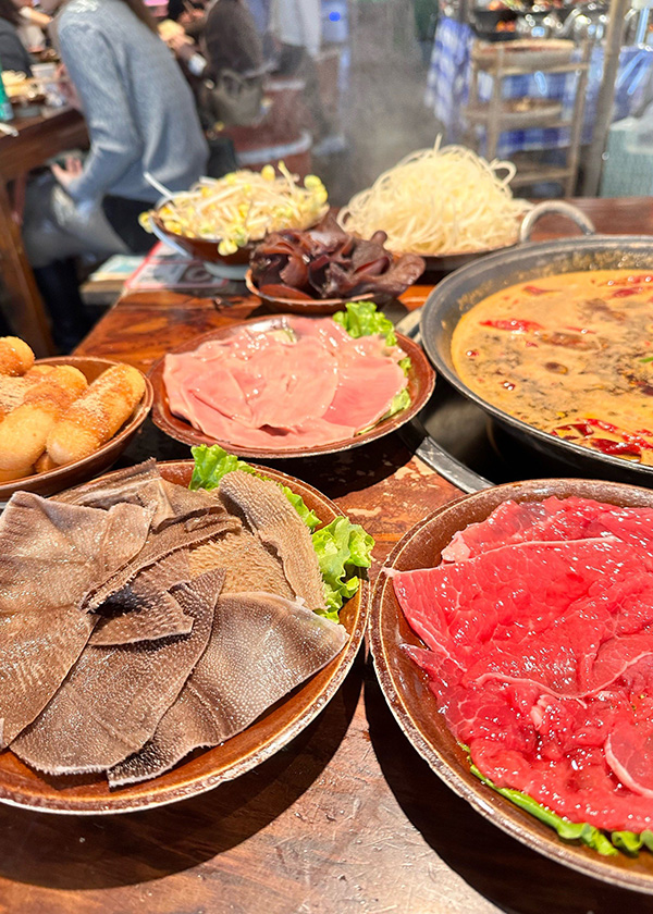 Lunch (12:30 PM - 2:00 PM): The Ultimate Chongqing Experience - Hot Pot
